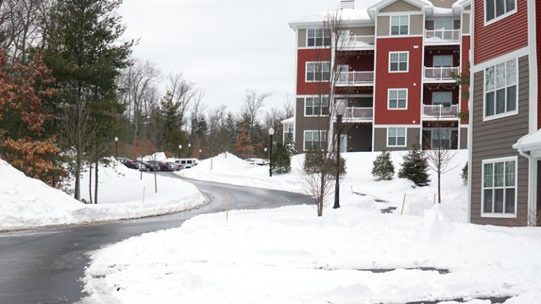Apartment community in winter with snow