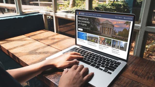 person searching for housing on laptop