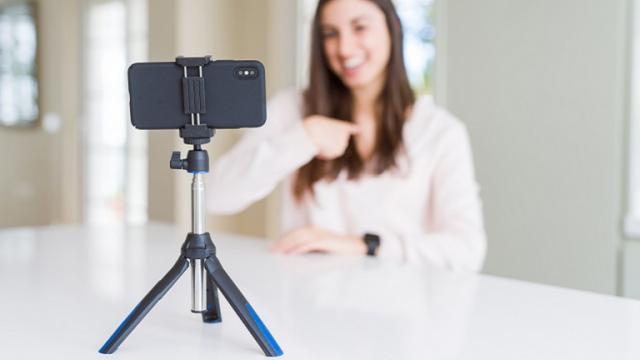 Woman records Instagram video on smartphone