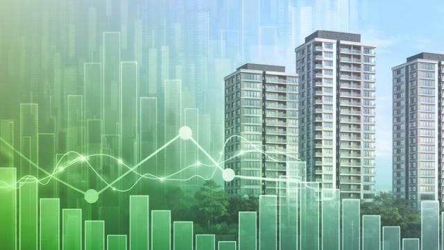 Charts and graphs superimposed over high-rise apartment buildings